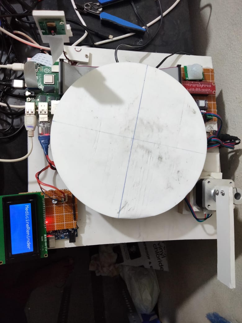 Medicine Reminder System — Raspberry Pi with rotating dispenser platform